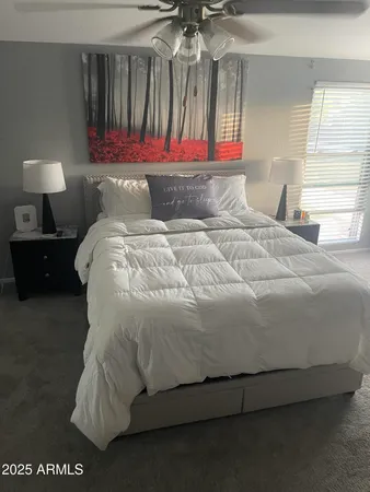 a bedroom with a bed and window