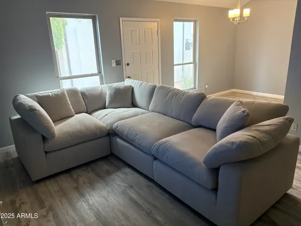 a living room with furniture and a window