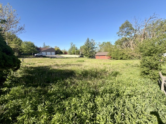 26178 Reed Street Ingleside, IL 60041 - Photo 6 of 10 a view of a lake with a house in the background