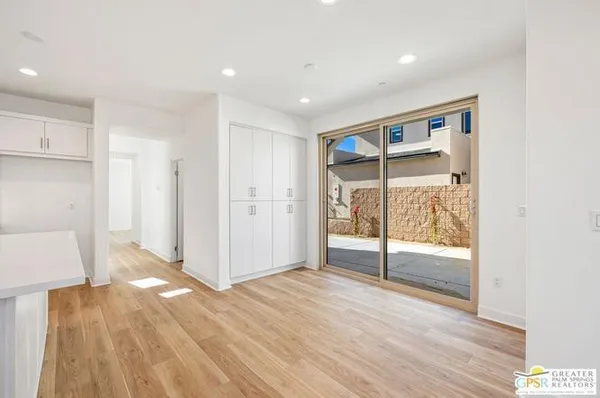 a view of entryway with wooden floor