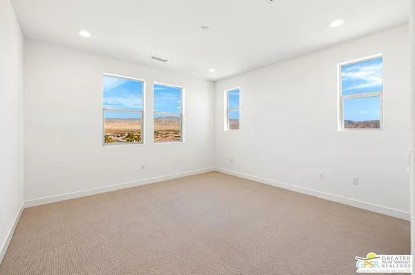 a view of a hallway with an empty room