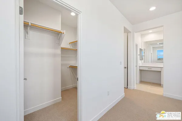 a bathroom with a sink a large mirror and a bathtub