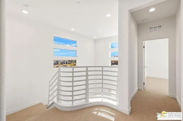 a view of an empty room with closet
