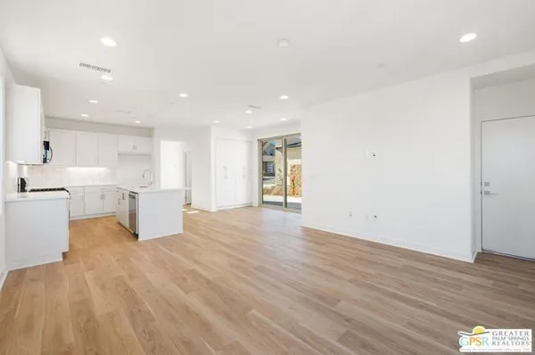 a view of kitchen with wooden floor