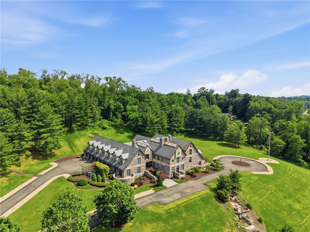 514 Justabout Road Venetia, PA 15367 - Photo 2 of 50 Located on a beautiful country road in Peters Township is a 17+ acre Estate including 16000sqft+ Luxury Home, 10 stall 2 story Horse Barn, 4 Bedroom 2 Story Guest House, water fall, pond, 5 car attached garage and so much more!