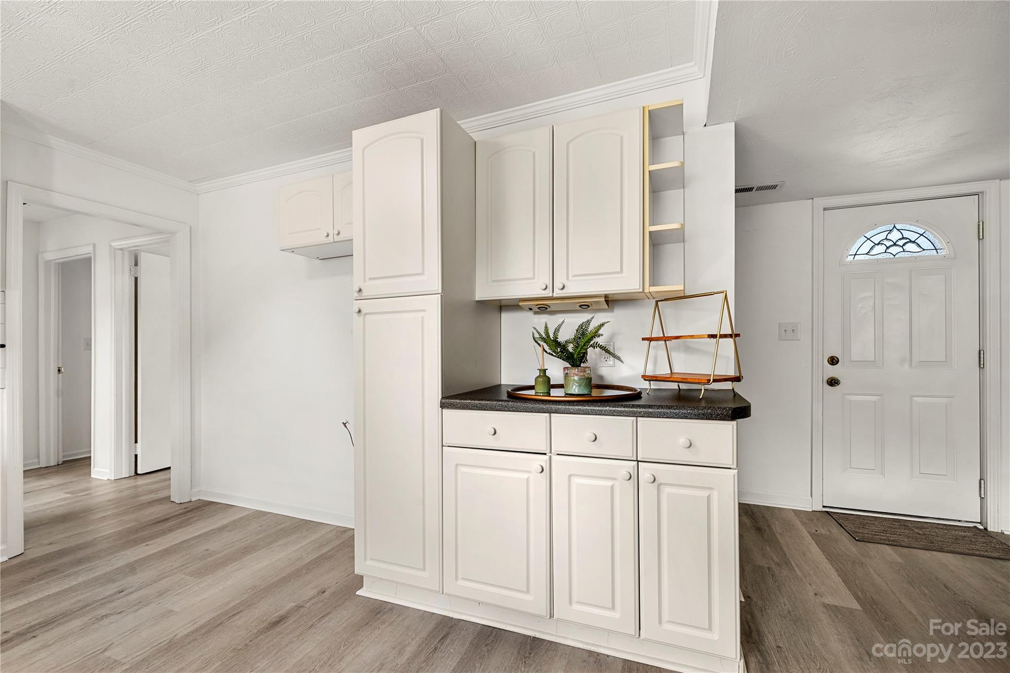 5836 Highway 601 Concord, NC 28025 - Photo 12 of 35 a kitchen with granite countertop white cabinets and sink