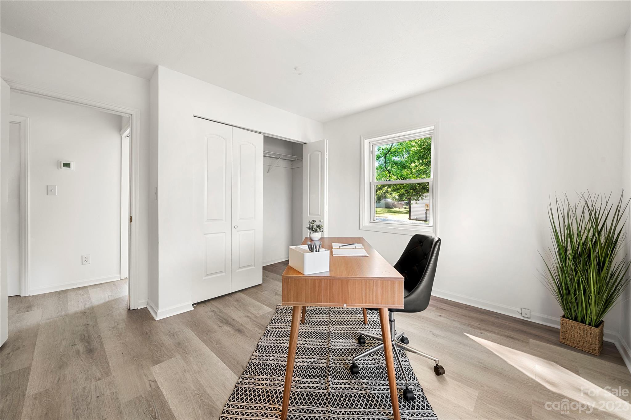 5836 Highway 601 Concord, NC 28025 - Photo 19 of 35 a view of a livingroom with furniture and a potted plant