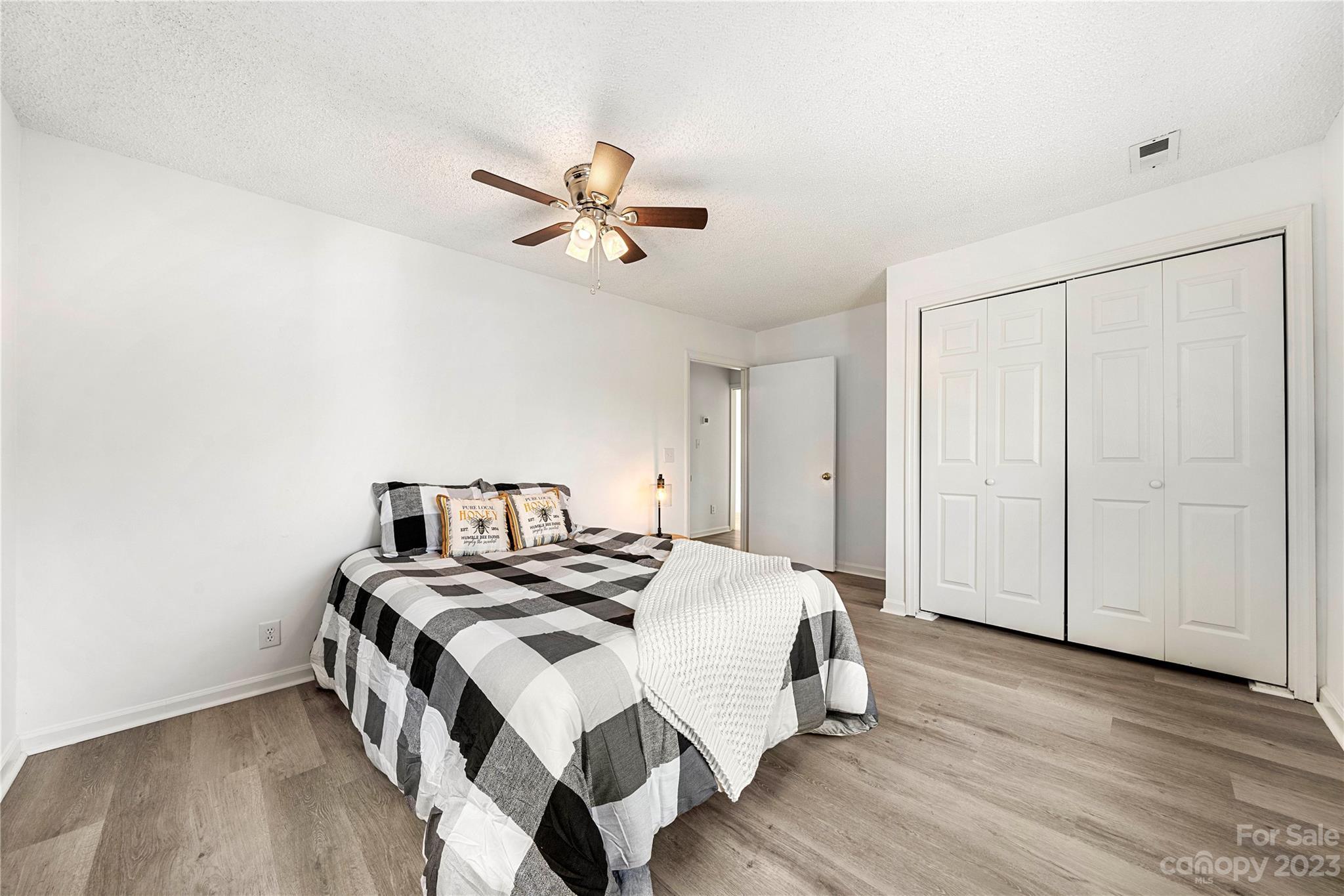 5836 Highway 601 Concord, NC 28025 - Photo 20 of 35 a bedroom with a bed and wooden floor