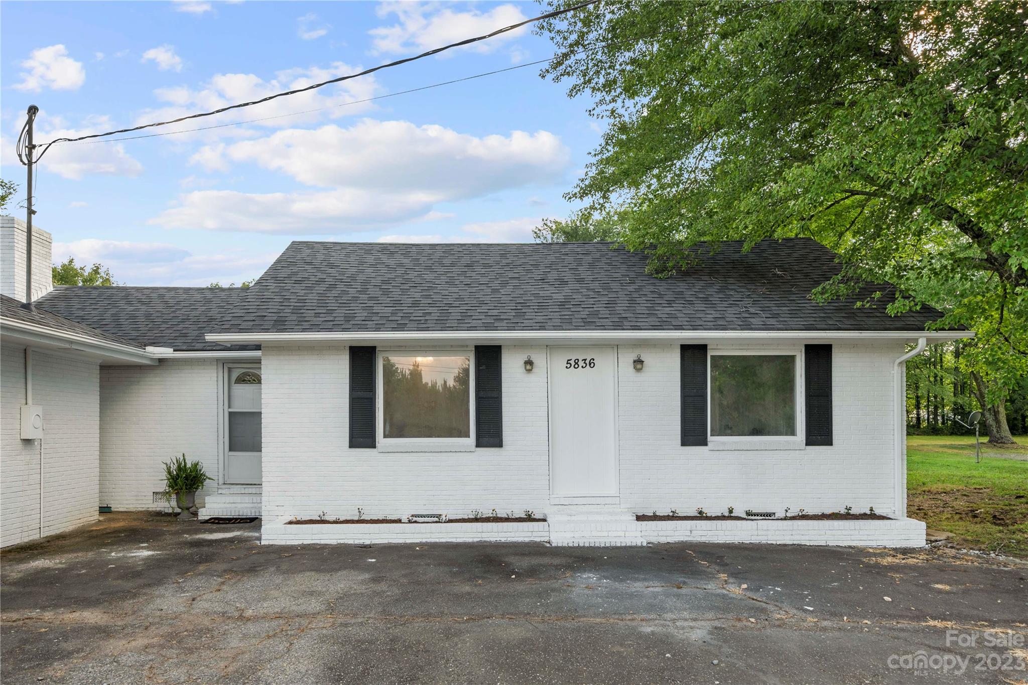 5836 Highway 601 Concord, NC 28025 - Photo 2 of 35 a house with white door of garage