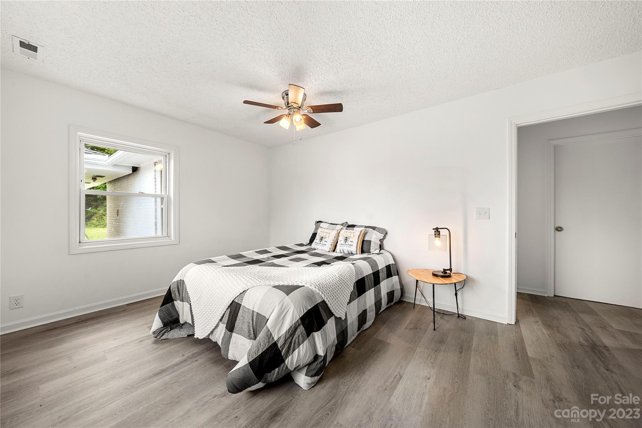 5836 Highway 601 Concord, NC 28025 - Photo 21 of 35 a bed room with a bed and a window