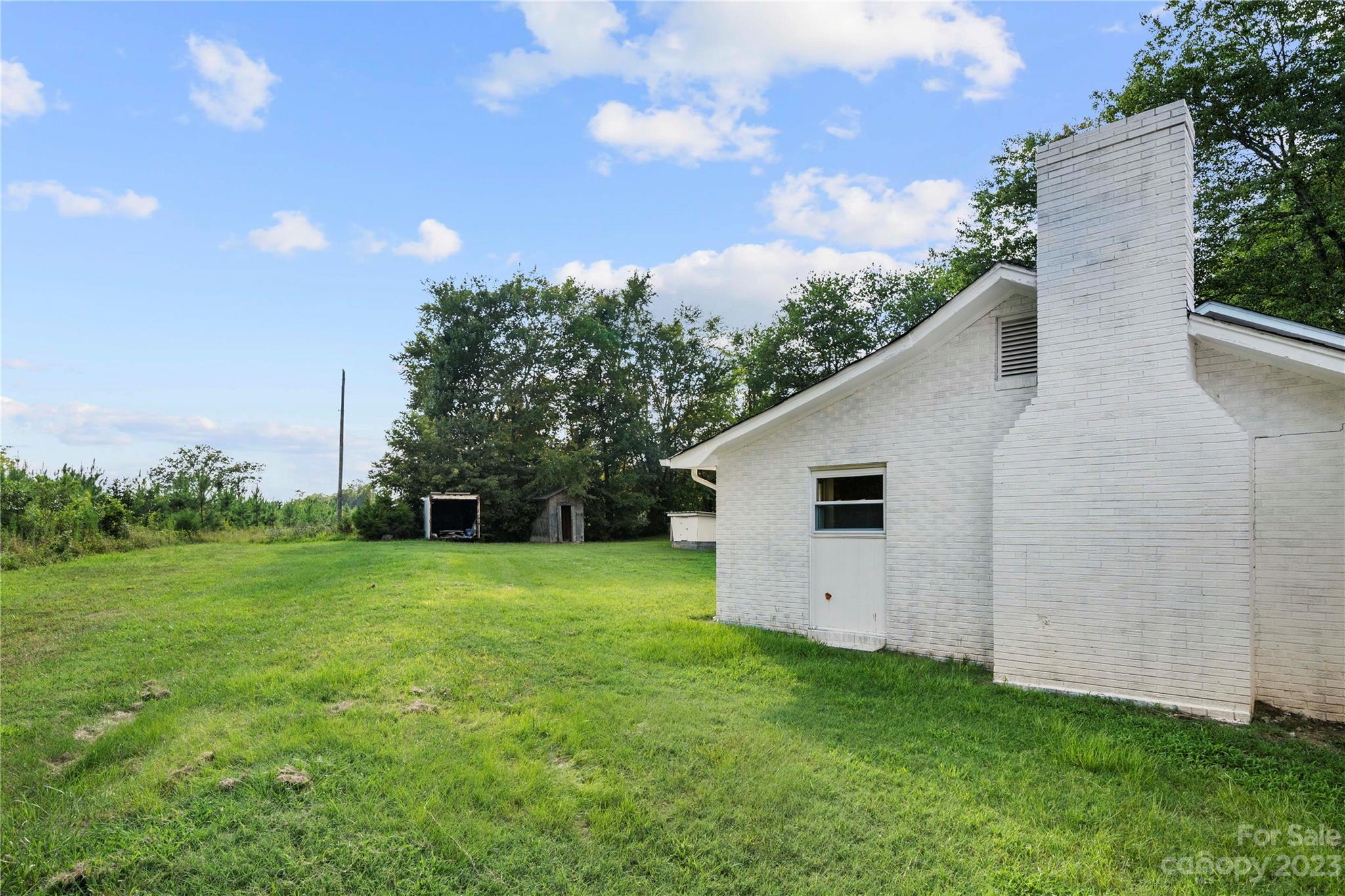 5836 Highway 601 Concord, NC 28025 - Photo 25 of 35 a view of a backyard with large trees