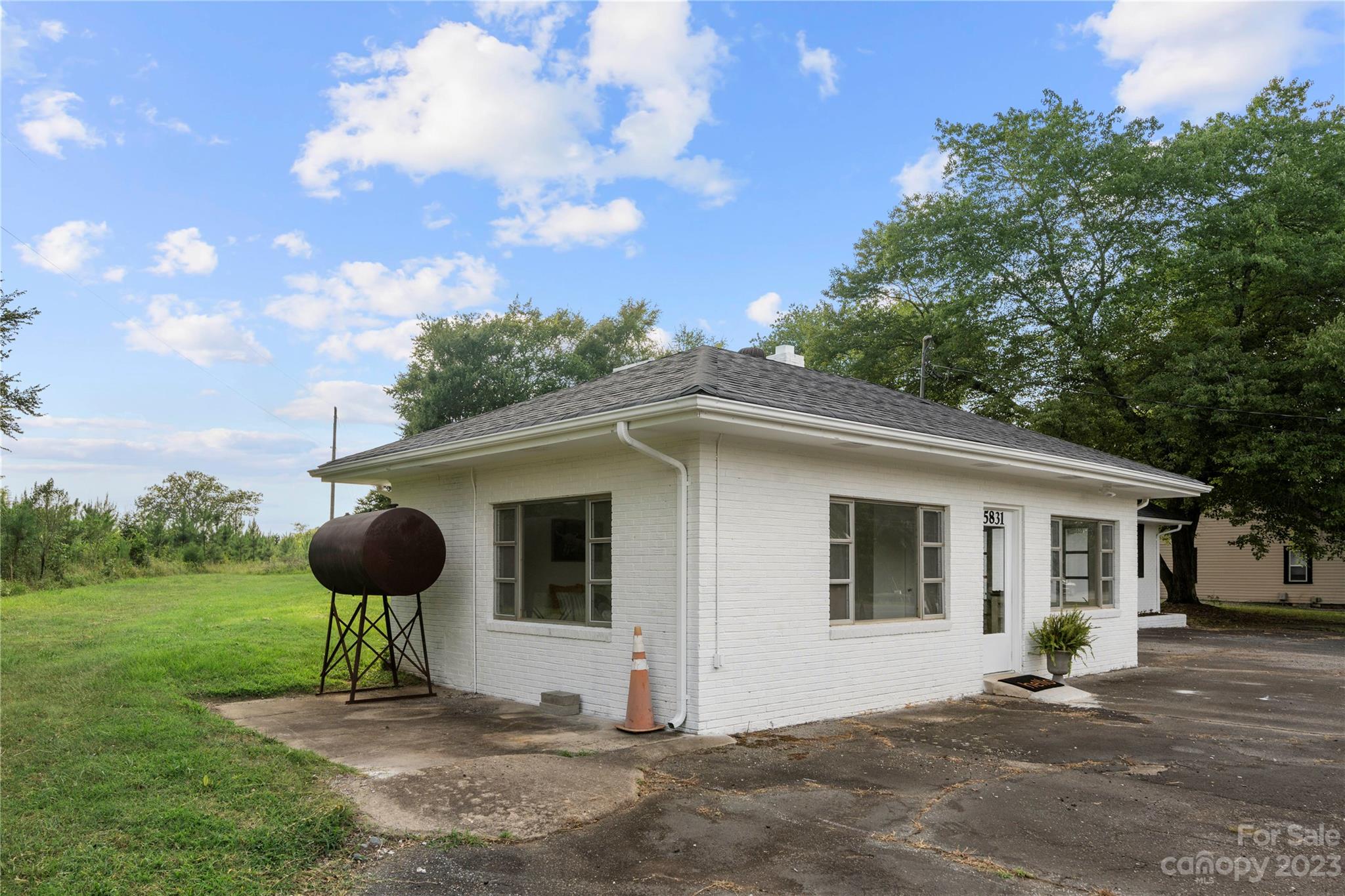 5836 Highway 601 Concord, NC 28025 - Photo 29 of 35 a front view of a house with a yard