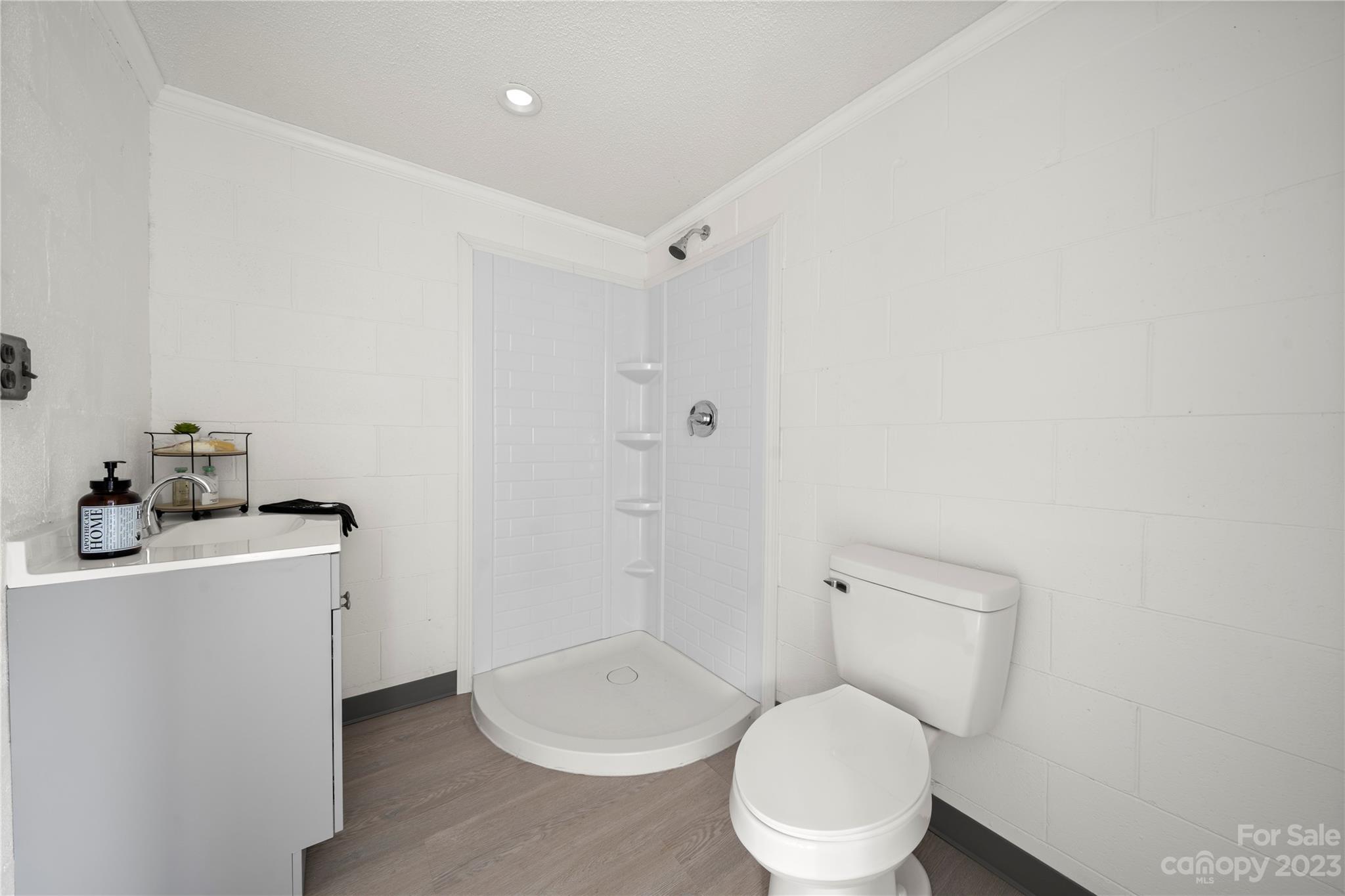 5836 Highway 601 Concord, NC 28025 - Photo 30 of 35 a bathroom with a toilet sink and mirror