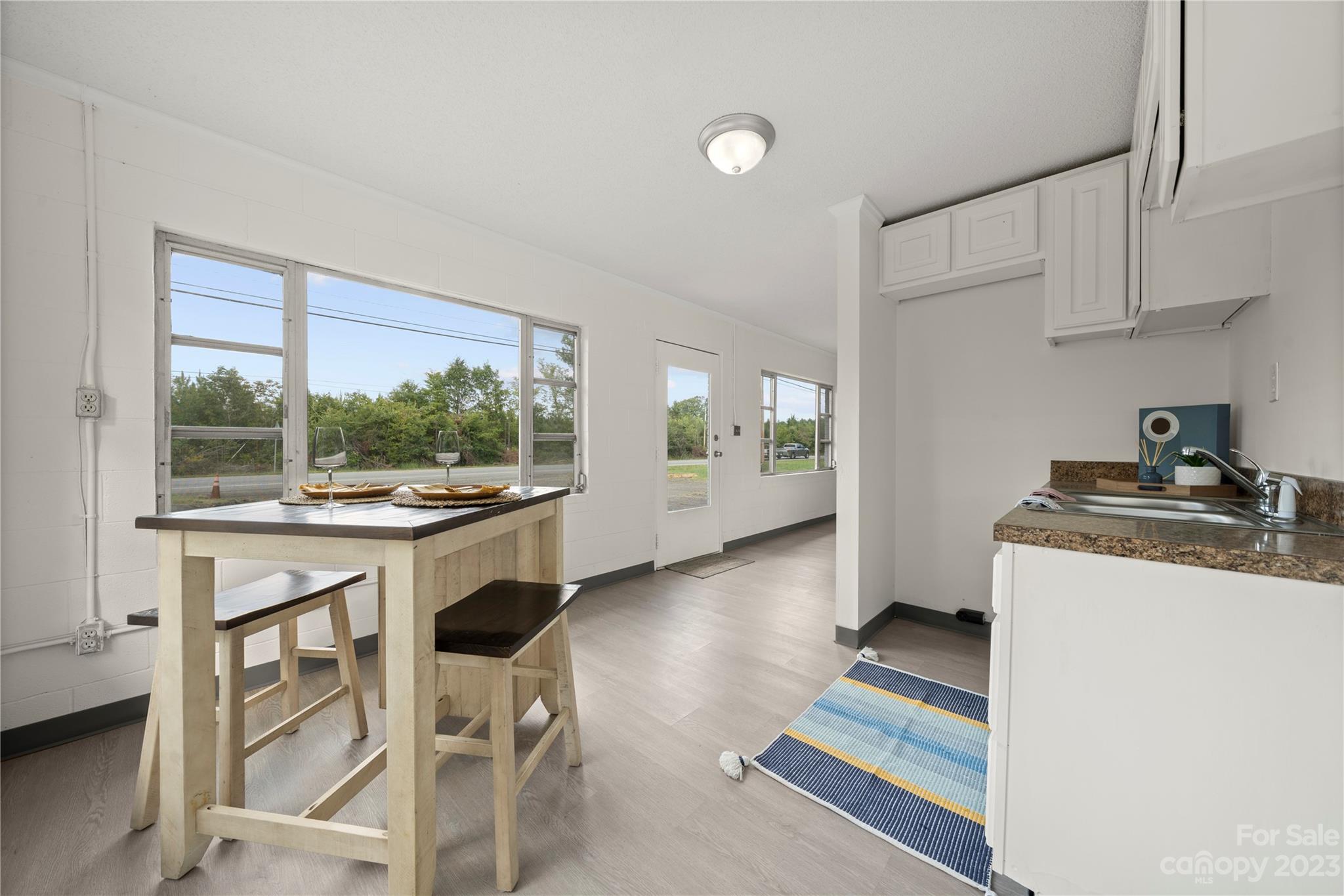 5836 Highway 601 Concord, NC 28025 - Photo 31 of 35 a kitchen with granite countertop a stove a sink and a refrigerator