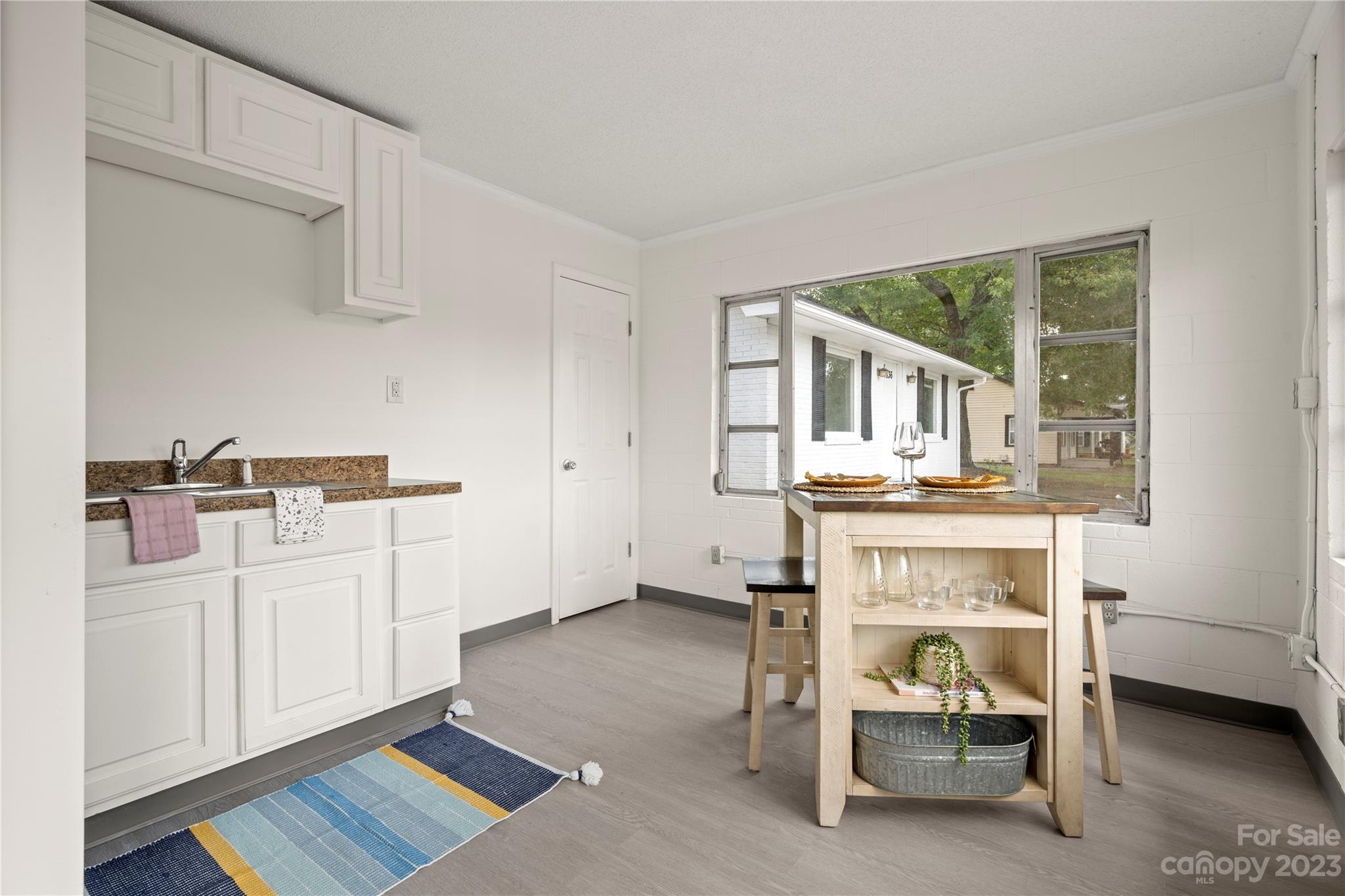 5836 Highway 601 Concord, NC 28025 - Photo 32 of 35 a living room with furniture a rug and a fireplace