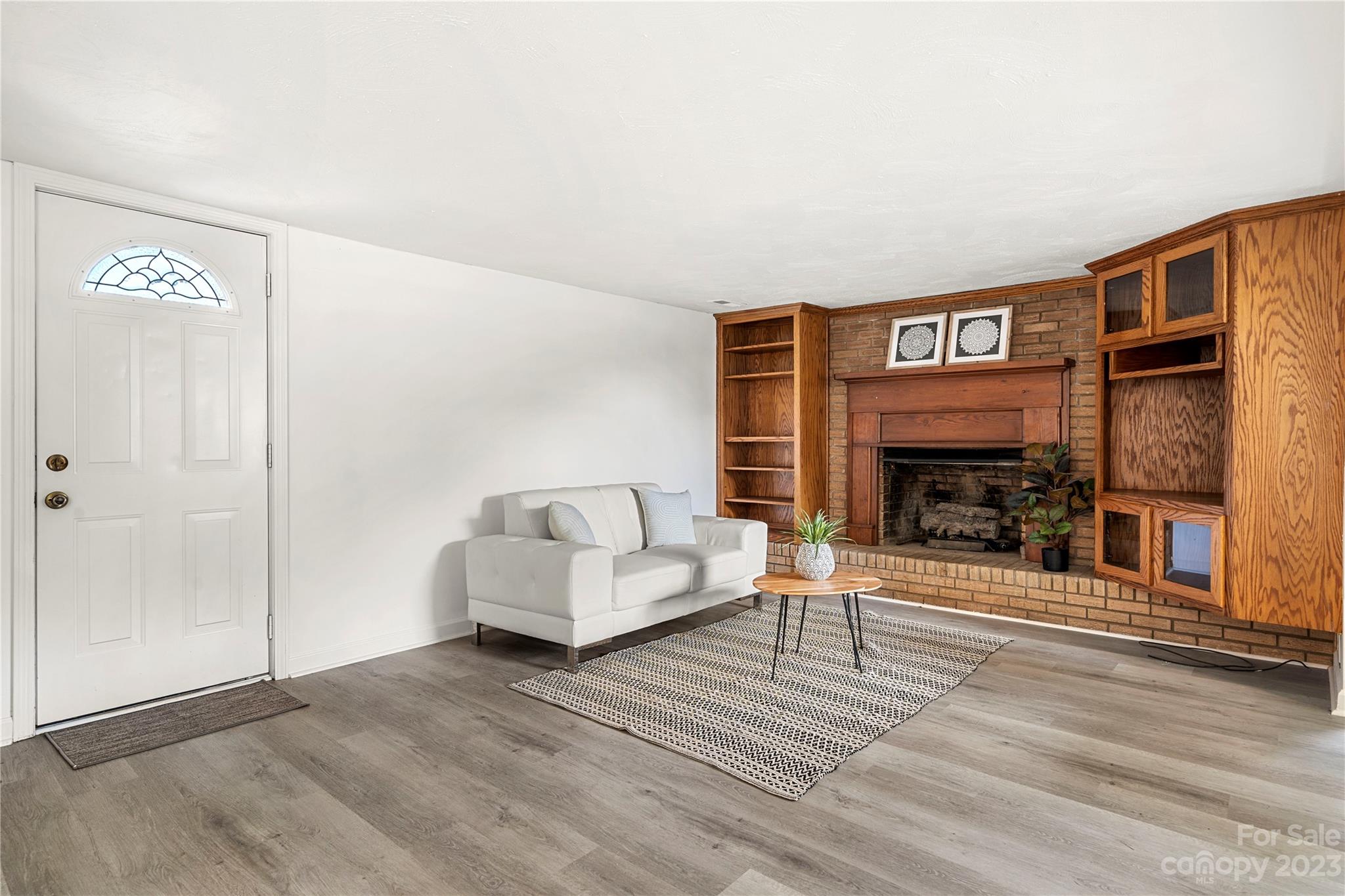 5836 Highway 601 Concord, NC 28025 - Photo 6 of 35 a living room with furniture and a fireplace