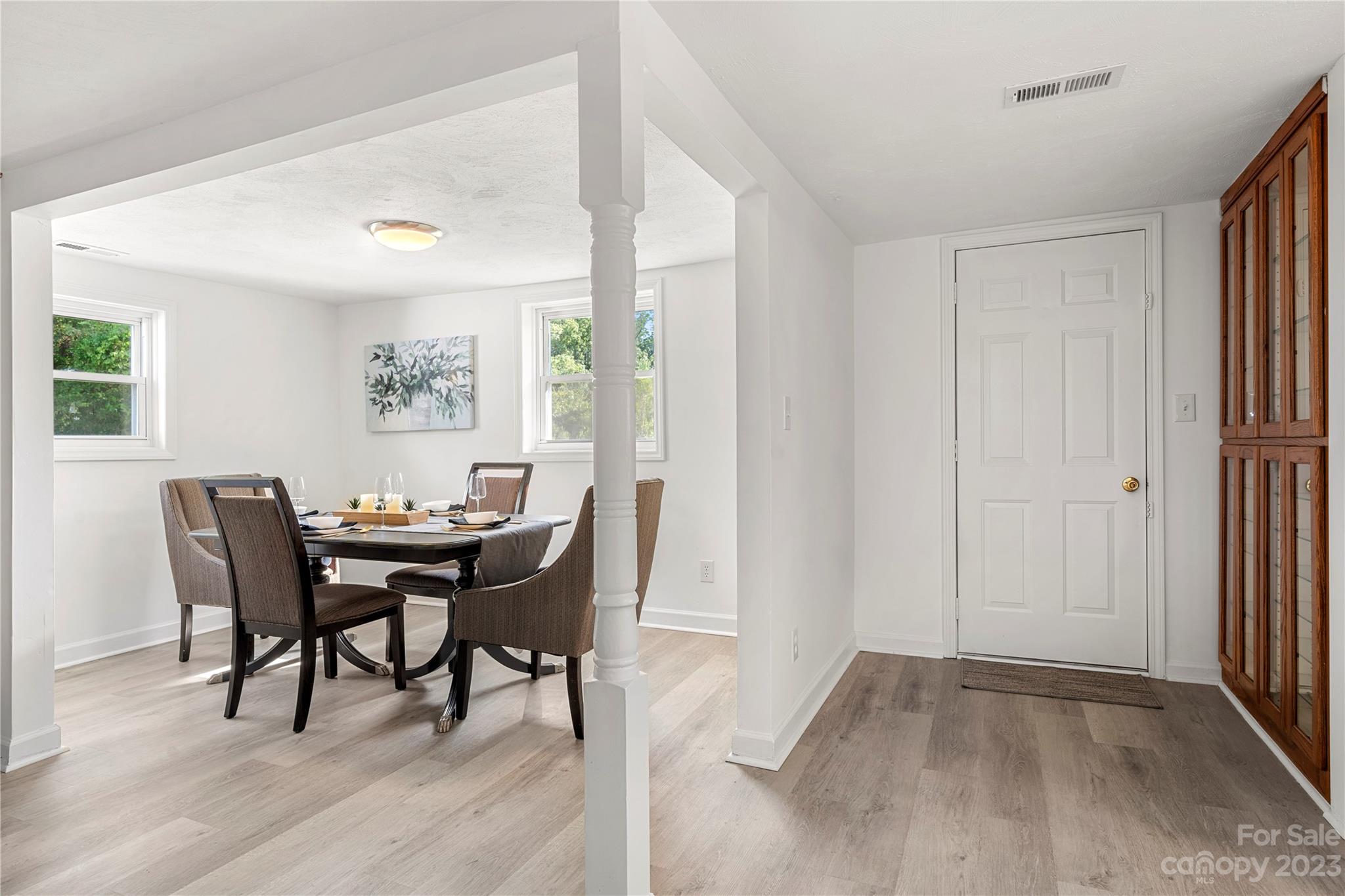 5836 Highway 601 Concord, NC 28025 - Photo 7 of 35 a view of a dining room with furniture and wooden floor