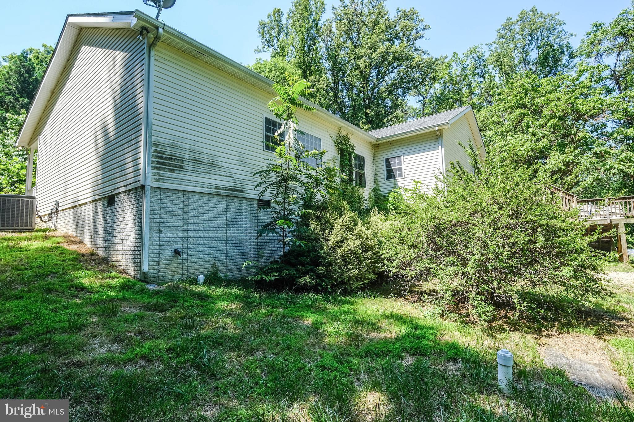 1195 Shangri-La Road Bentonville, VA 22610 - Photo 10 of 64 a view of a house with a yard