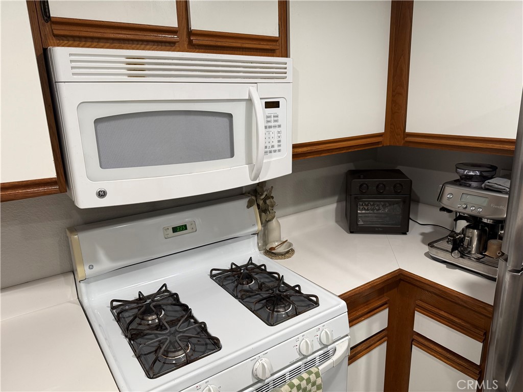 23 Pomelo Rancho Santa Margarita, CA 92688 - Photo 11 of 28 a stove top oven sitting inside of a kitchen