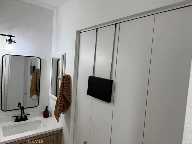 a bathroom with a shower and a mirror