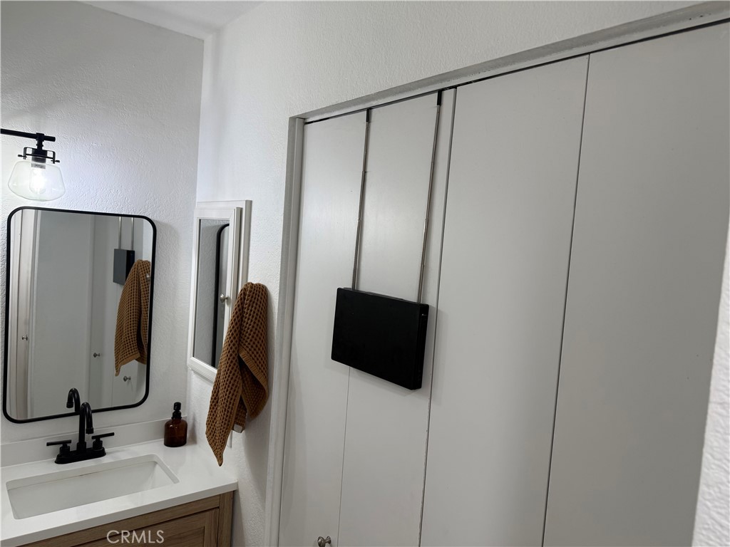 23 Pomelo Rancho Santa Margarita, CA 92688 - Photo 20 of 28 a bathroom with a shower and a mirror