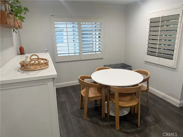 a dining room with a table and chairs