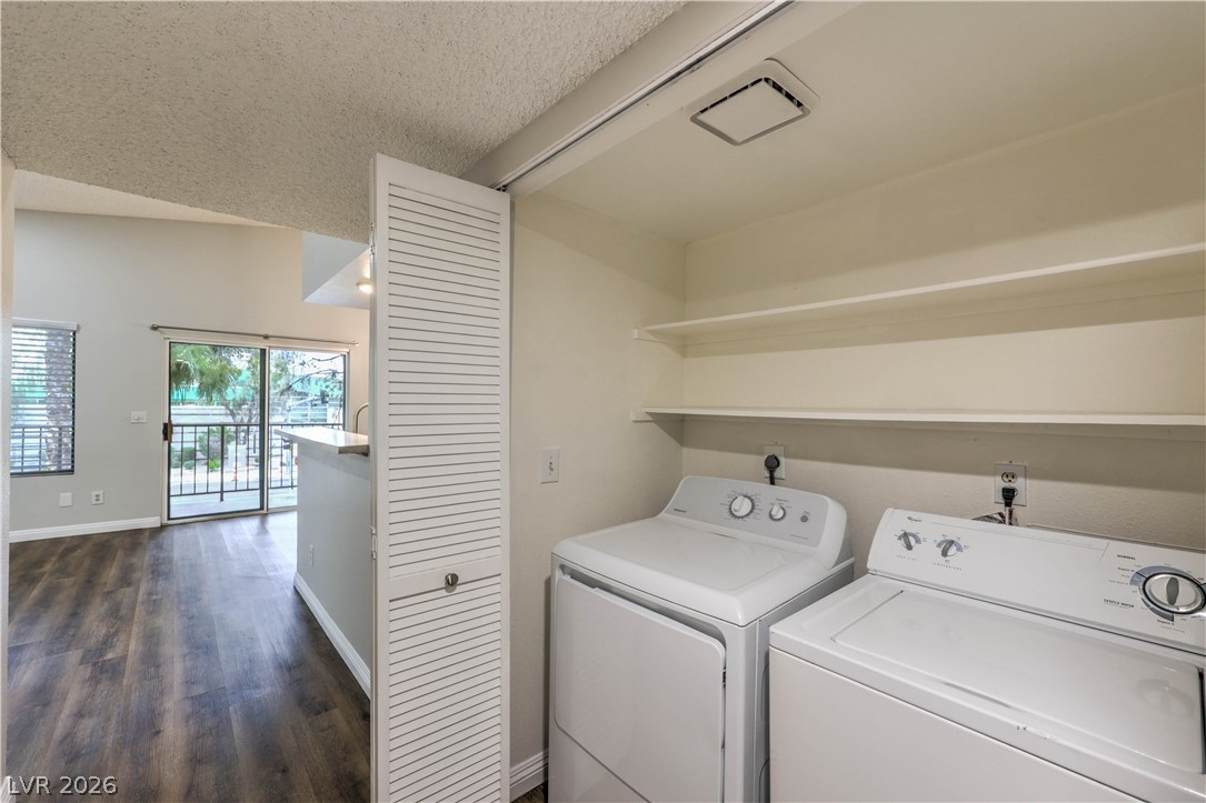 1575 West Warm Springs Road, Unit 322 Henderson, NV 89014 - Photo 20 of 25 This laundry area features convenient storage and direct access to open living spaces and outdoor views.