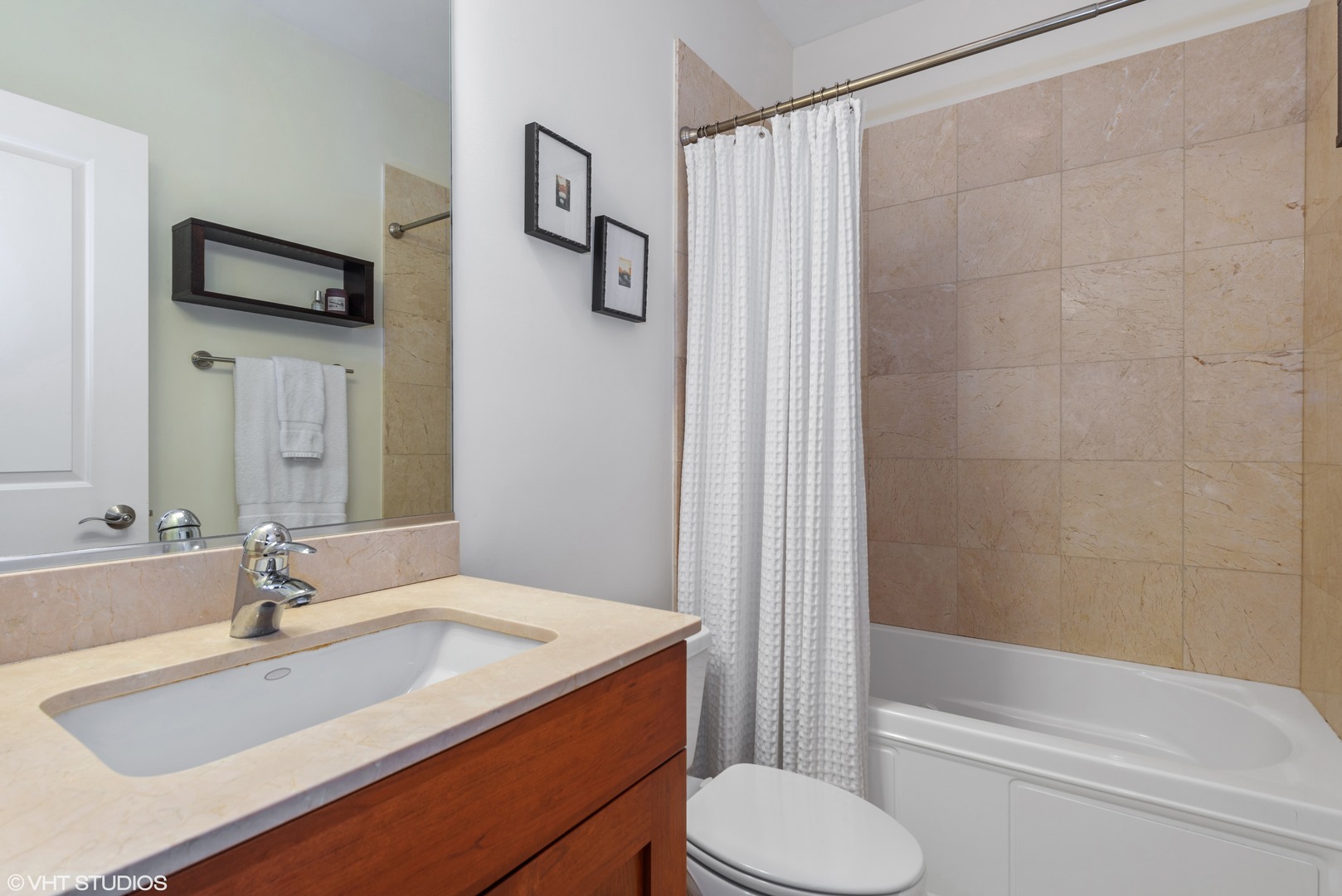 1025 West Monroe Street, Unit 3E Chicago, IL 60607 - Photo 13 of 14 a bathroom with a sink toilet and shower