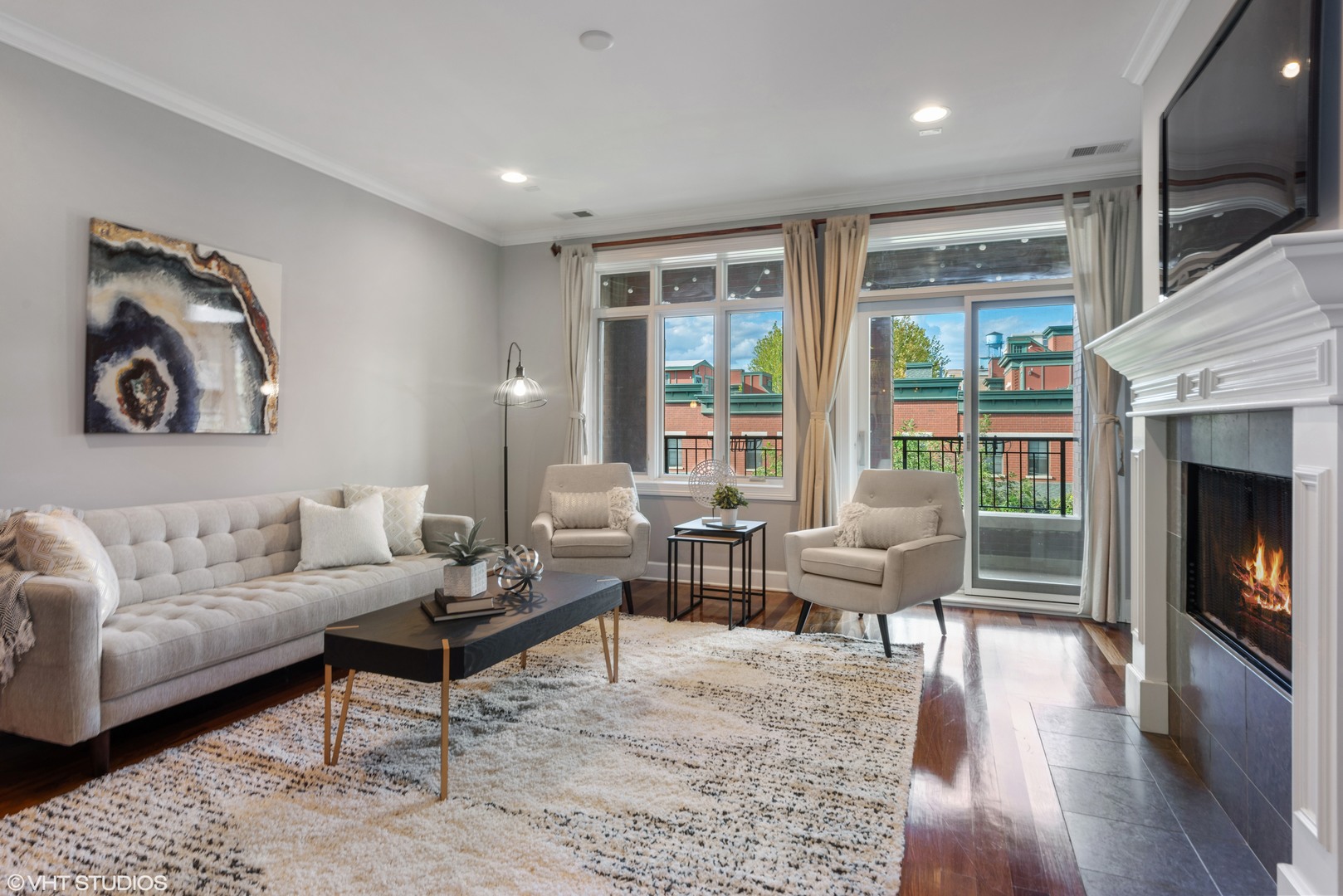 1025 West Monroe Street, Unit 3E Chicago, IL 60607 - Photo 4 of 14 a living room with furniture and a fireplace