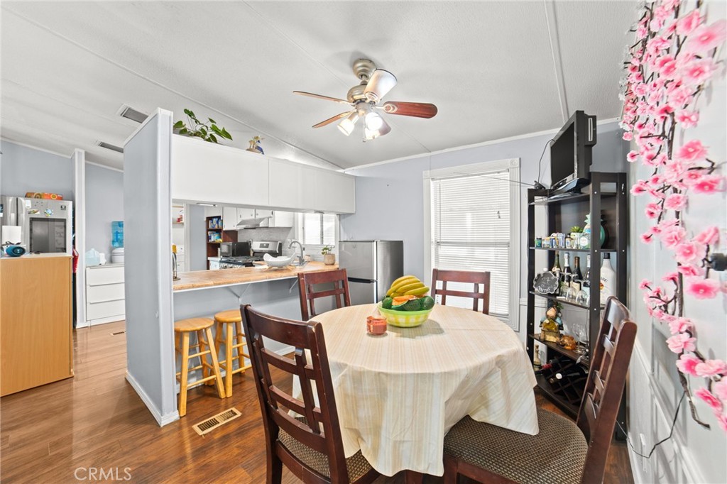 1155 South Riverside Avenue, Unit 22 Rialto, CA 92376 - Photo 11 of 34 a dining room with furniture and window