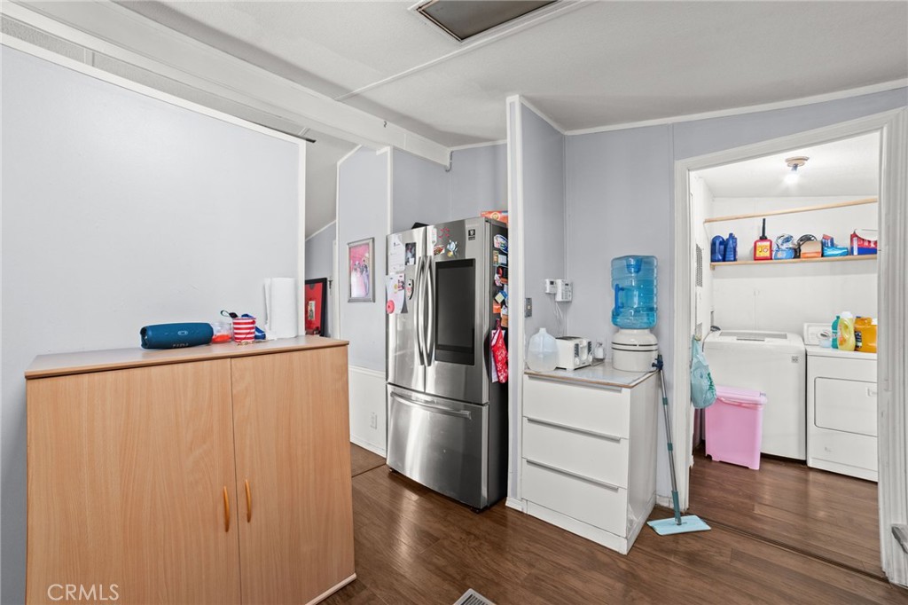 1155 South Riverside Avenue, Unit 22 Rialto, CA 92376 - Photo 17 of 34 a room with furniture and a refrigerator