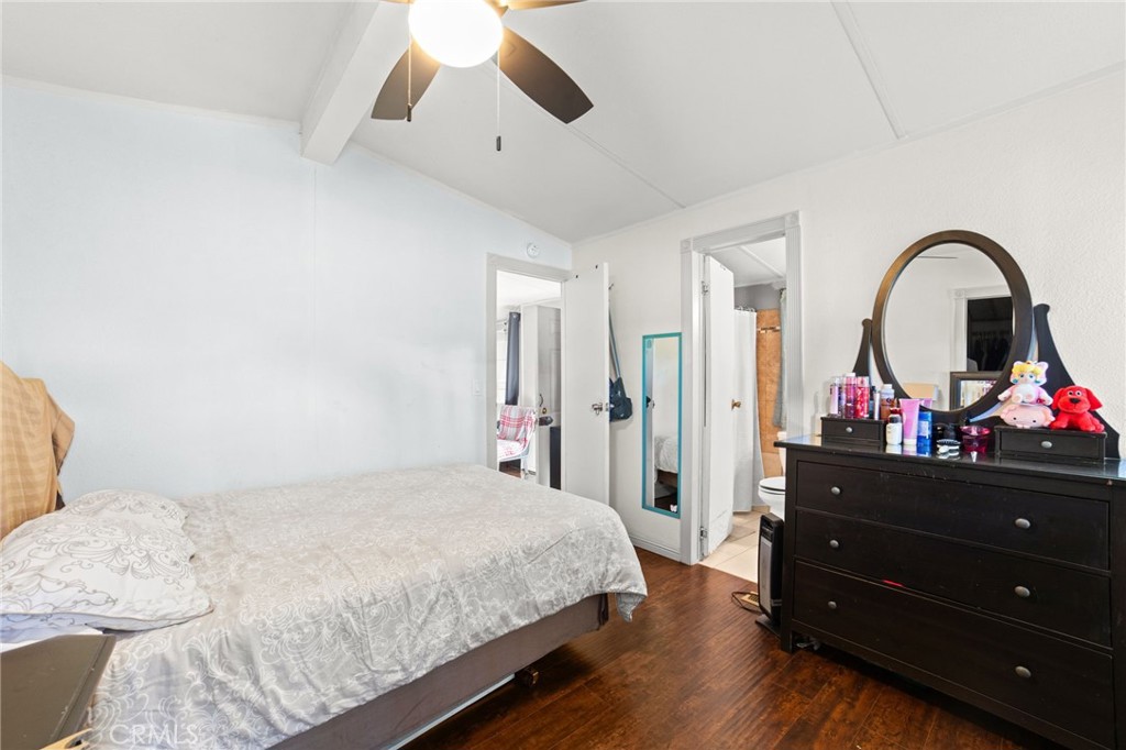 1155 South Riverside Avenue, Unit 22 Rialto, CA 92376 - Photo 20 of 34 a bedroom with a bed and a dresser