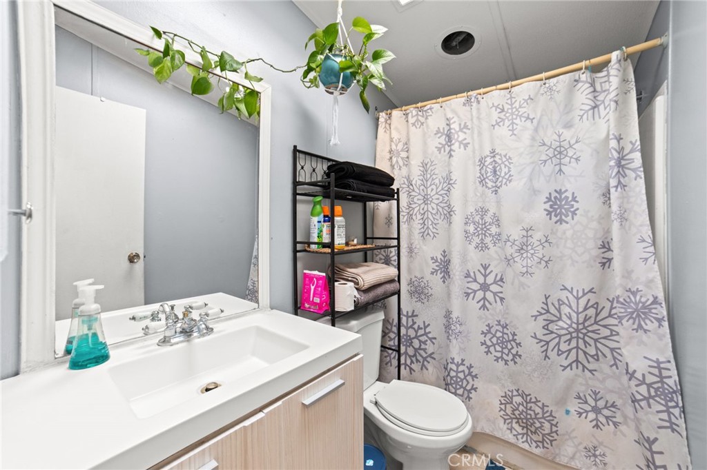 1155 South Riverside Avenue, Unit 22 Rialto, CA 92376 - Photo 25 of 34 a bathroom with a sink toilet and shower