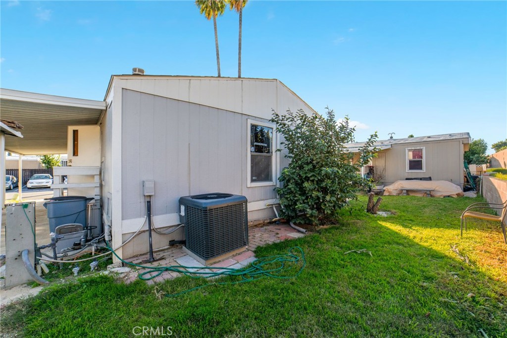1155 South Riverside Avenue, Unit 22 Rialto, CA 92376 - Photo 29 of 34 a view of backyard with a garden and plants