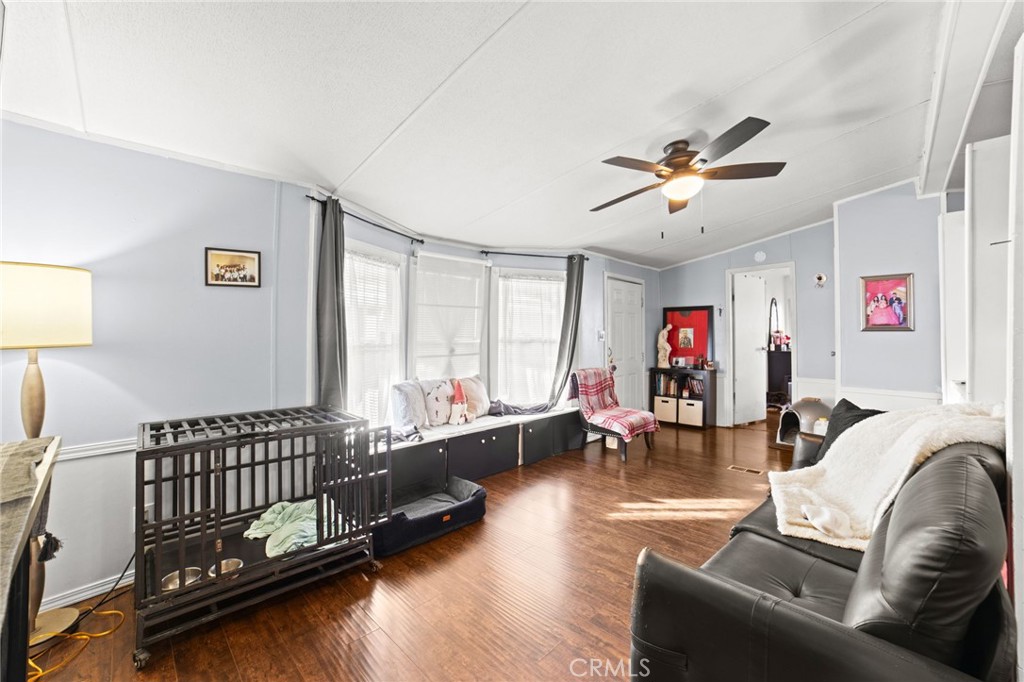 1155 South Riverside Avenue, Unit 22 Rialto, CA 92376 - Photo 8 of 34 a bed room with furniture and a window