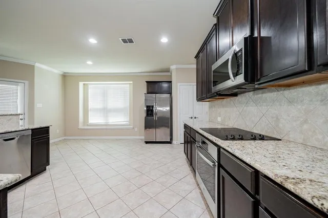 a large bathroom with a granite countertop sink and a large mirror