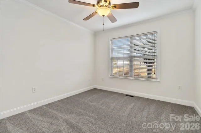 an empty room with fan