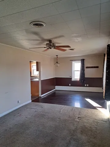 a view of empty room with windows