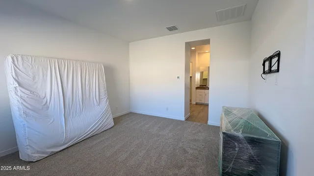 a room with a bed and a window