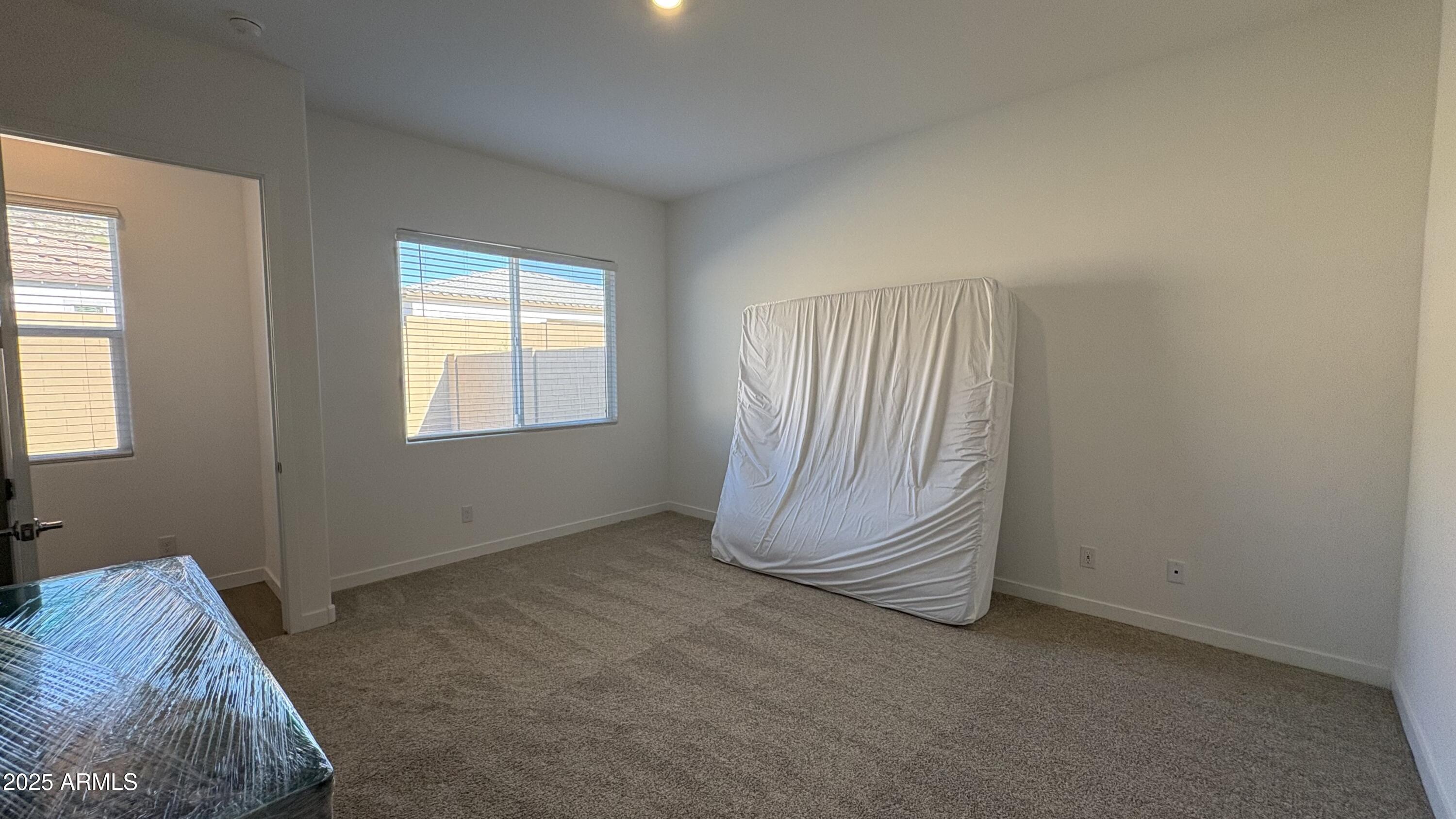 3240 West Peak View Road Phoenix, AZ 85083 - Photo 12 of 37 a room with a bed and a window