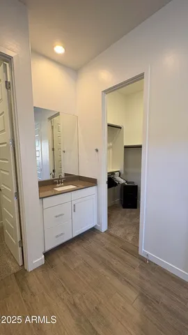a view of a bathroom with a sink and a mirror