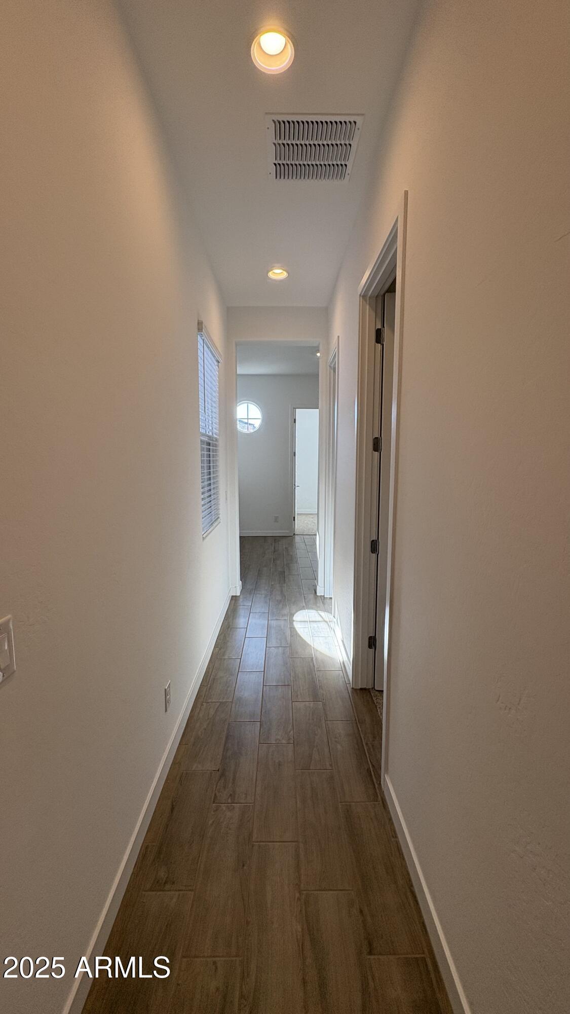 3240 West Peak View Road Phoenix, AZ 85083 - Photo 18 of 37 a view of a hallway with wooden floor