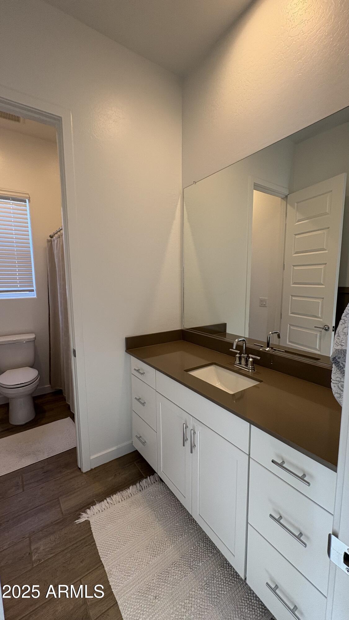 3240 West Peak View Road Phoenix, AZ 85083 - Photo 27 of 37 a bathroom with a granite countertop sink and a toilet