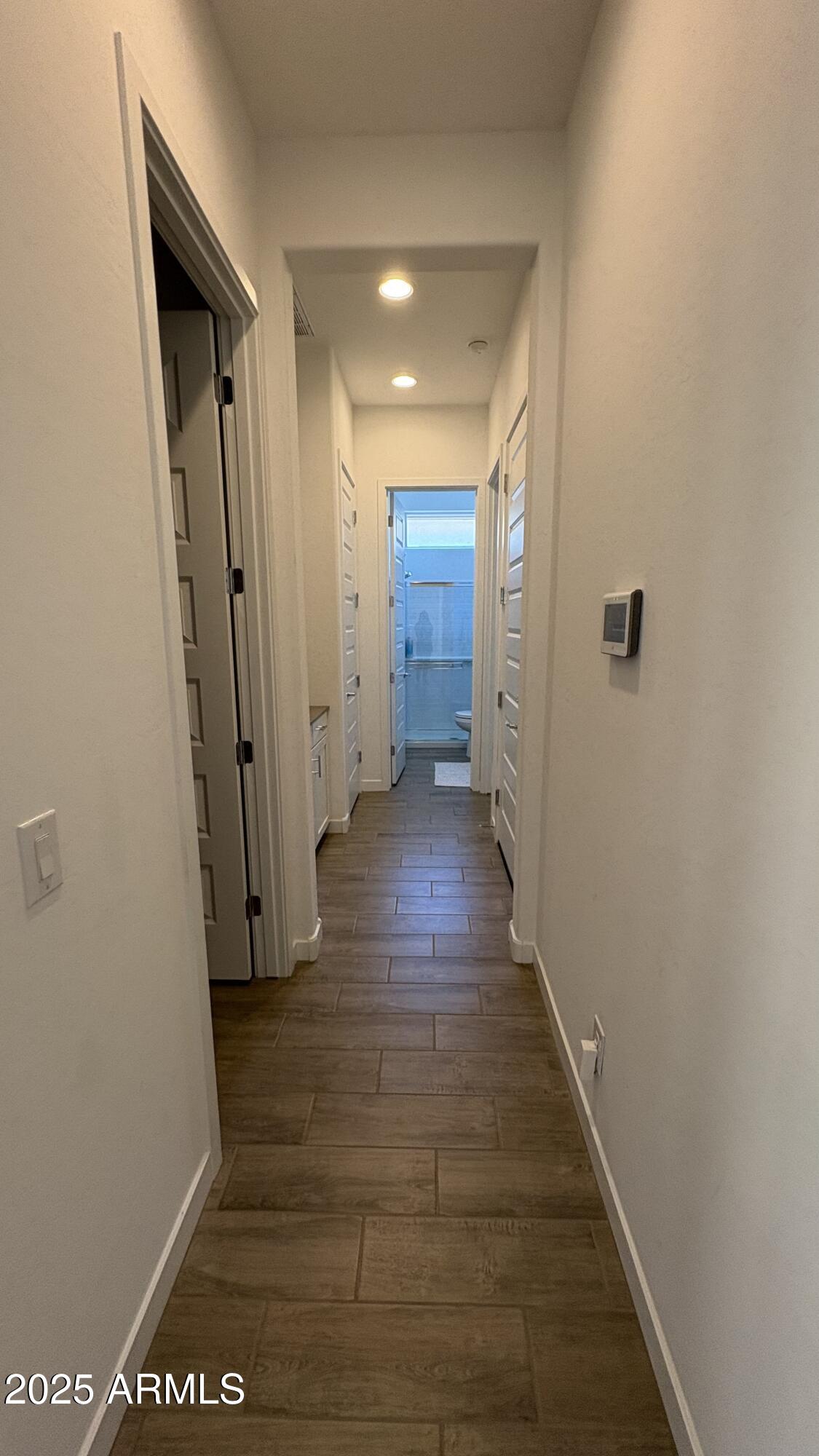 3240 West Peak View Road Phoenix, AZ 85083 - Photo 30 of 37 a view of a hallway with wooden floor