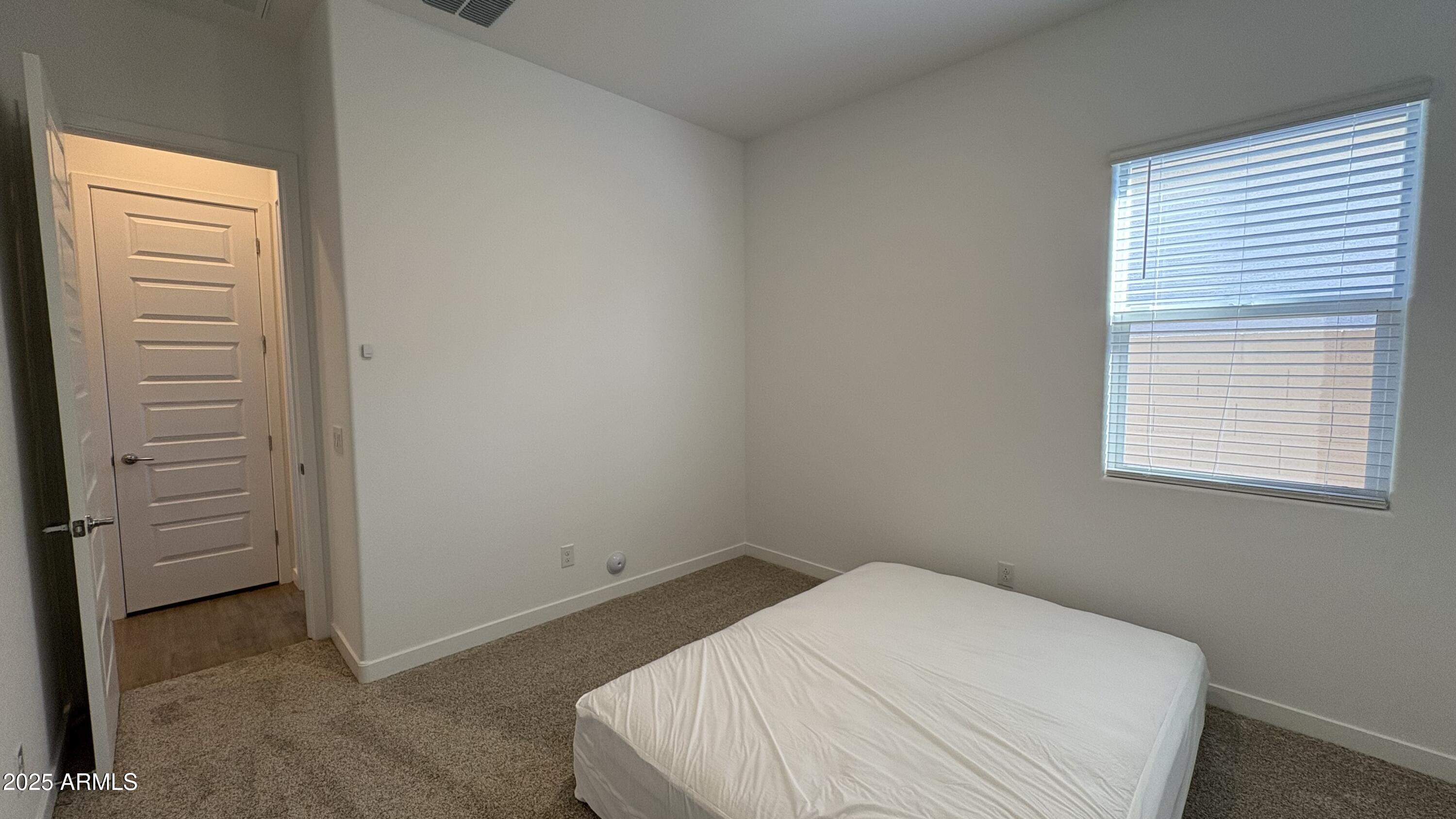 3240 West Peak View Road Phoenix, AZ 85083 - Photo 33 of 37 a bedroom with a bed and a window