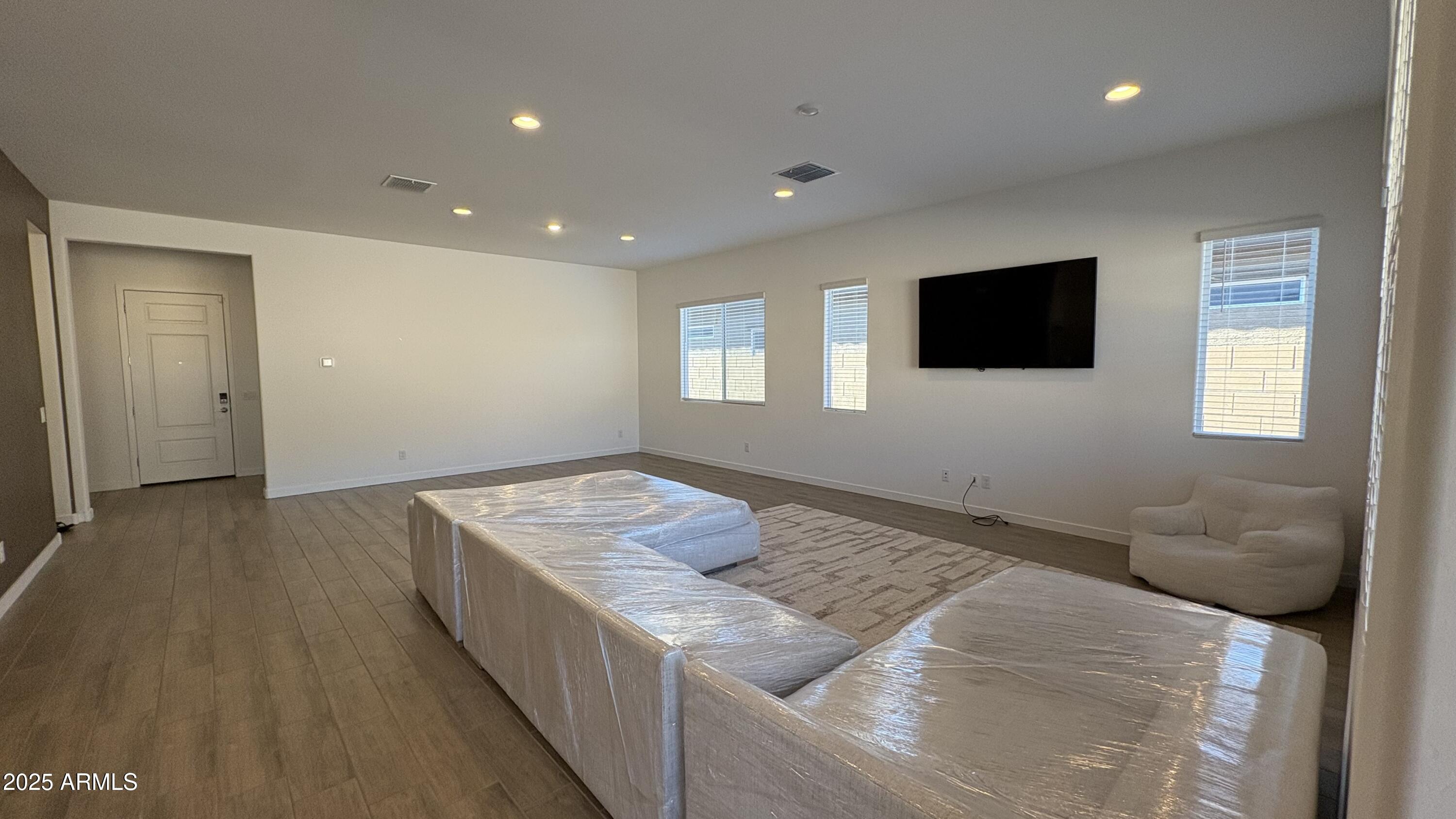 3240 West Peak View Road Phoenix, AZ 85083 - Photo 5 of 37 a bedroom with a bed and a flat screen tv