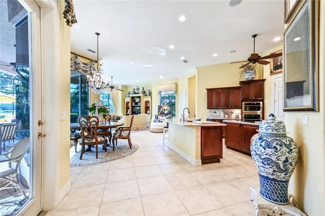 a large kitchen with furniture and a table