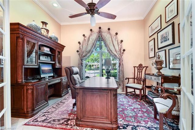 a view of a livingroom with furniture and workspace