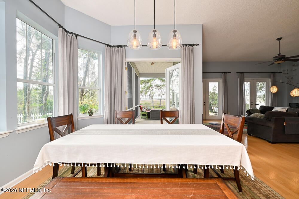 1470 Marshview Court Atlantic Beach, FL 32233 - Photo 7 of 51 Dining Area - View 4 - Lanai Doors Open