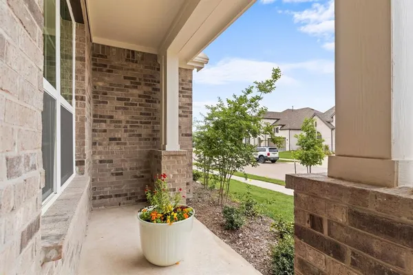 a view of a balcony with plants and garden